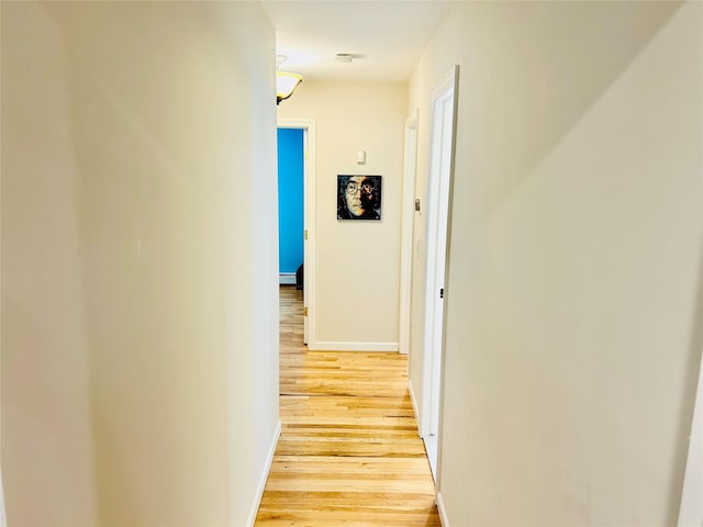 2 W Rd, East Setauket, NY 11733 - hall with light wood-style floors and baseboards