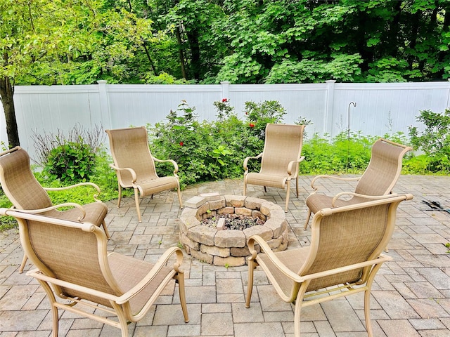 2 W Rd, East Setauket, NY 11733 - view of patio featuring an outdoor fire pit and a fenced backyard