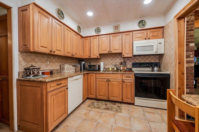 3176 Benjamin Rd, Oceanside, NY 11572 - kitchen with white appliances, a sink, light stone counters, tasteful backsplash, and ornamental molding