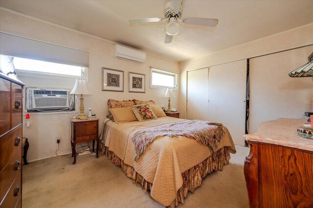 3176 Benjamin Rd, Oceanside, NY 11572 - bedroom with a wall unit AC, light colored carpet, a closet, ceiling fan, and crown molding