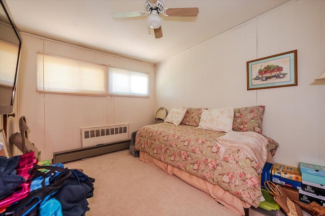 3176 Benjamin Rd, Oceanside, NY 11572 - carpeted bedroom featuring baseboard heating, radiator, and a ceiling fan