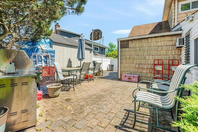 3176 Benjamin Rd, Oceanside, NY 11572 - view of patio / terrace with fence and an outdoor kitchen