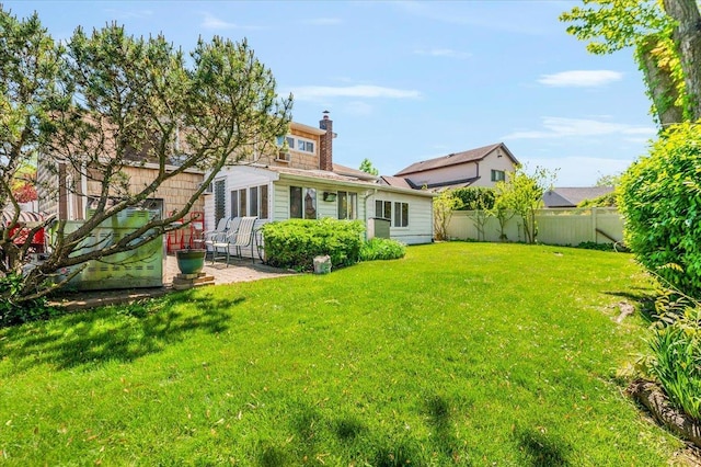 3176 Benjamin Rd, Oceanside, NY 11572 - back of property featuring a patio and a chimney