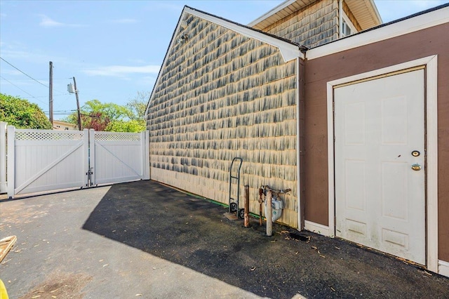 3176 Benjamin Rd, Oceanside, NY 11572 - view of exterior entry featuring a gate