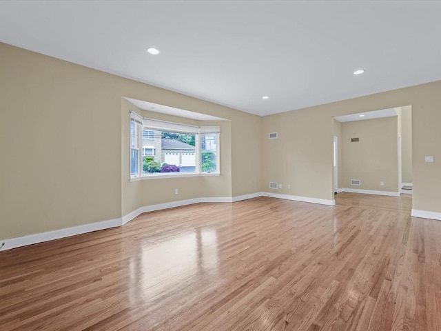 12 Pleasant Ave, Port Washington, NY 11050 - spare room featuring light wood-style floors, baseboards, and recessed lighting
