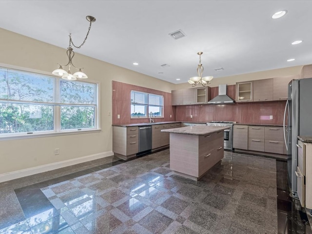 12 Pleasant Ave, Port Washington, NY 11050 - kitchen with a chandelier, appliances with stainless steel finishes, granite floors, wall chimney range hood, and recessed lighting