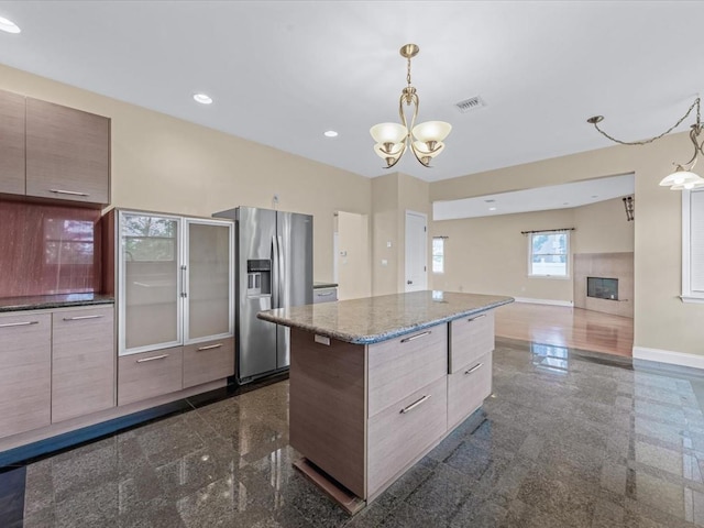 12 Pleasant Ave, Port Washington, NY 11050 - kitchen featuring stainless steel fridge, granite floors, modern cabinets, and recessed lighting