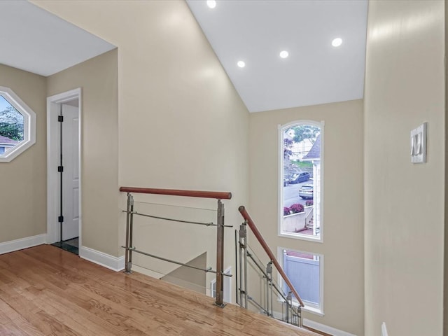 12 Pleasant Ave, Port Washington, NY 11050 - staircase with healthy amount of natural light, wood finished floors, baseboards, and recessed lighting