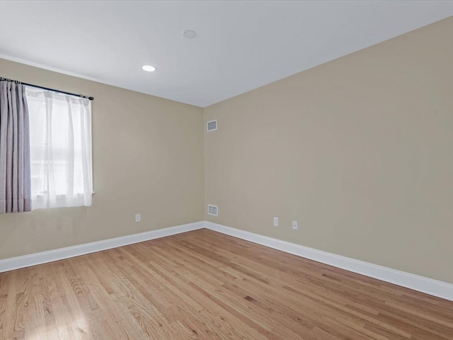 12 Pleasant Ave, Port Washington, NY 11050 - spare room with baseboards, light wood finished floors, and recessed lighting