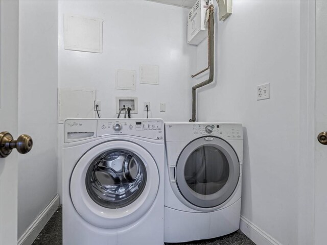 12 Pleasant Ave, Port Washington, NY 11050 - washroom featuring baseboards and independent washer and dryer