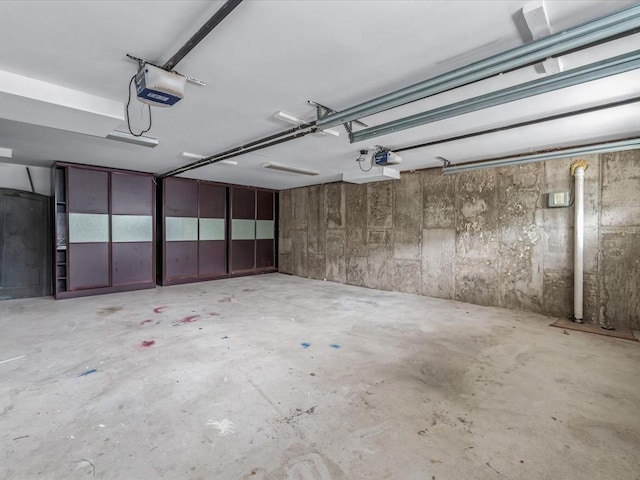 12 Pleasant Ave, Port Washington, NY 11050 - garage featuring a garage door opener