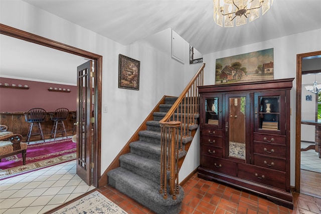 11 Carnelli Ct, Poughkeepsie, NY 12603 - staircase featuring a chandelier and baseboards