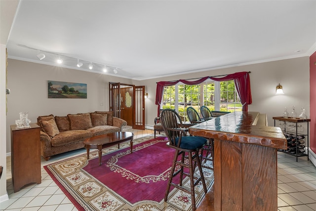 11 Carnelli Ct, Poughkeepsie, NY 12603 - living room with light tile patterned floors, a dry bar, crown molding, and baseboards