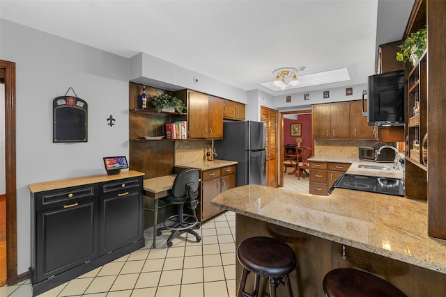 11 Carnelli Ct, Poughkeepsie, NY 12603 - kitchen with freestanding refrigerator, open shelves, a peninsula, and backsplash