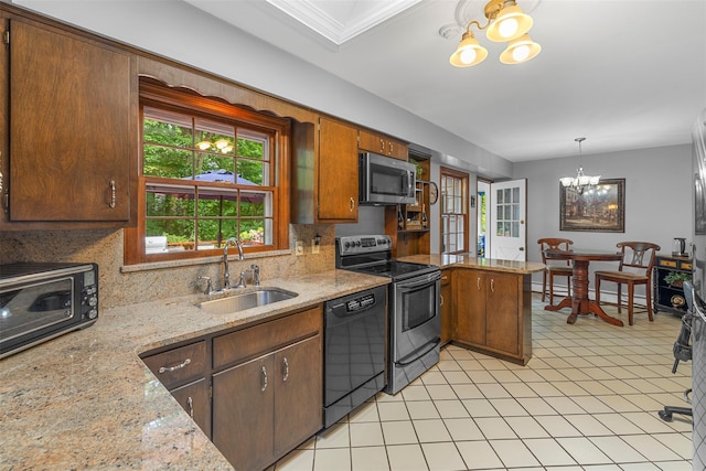 11 Carnelli Ct, Poughkeepsie, NY 12603 - kitchen with appliances with stainless steel finishes, a sink, a chandelier, decorative backsplash, and a peninsula