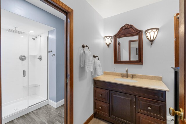 11 Carnelli Ct, Poughkeepsie, NY 12603 - full bathroom featuring a shower stall, vanity, wood finished floors, and baseboards