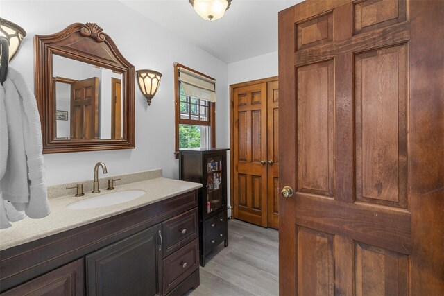 11 Carnelli Ct, Poughkeepsie, NY 12603 - bathroom with vanity and wood finished floors