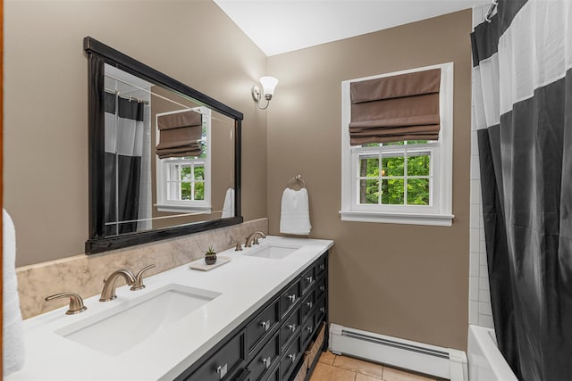 11 Carnelli Ct, Poughkeepsie, NY 12603 - bathroom with a baseboard heating unit, plenty of natural light, double vanity, and tile patterned floors