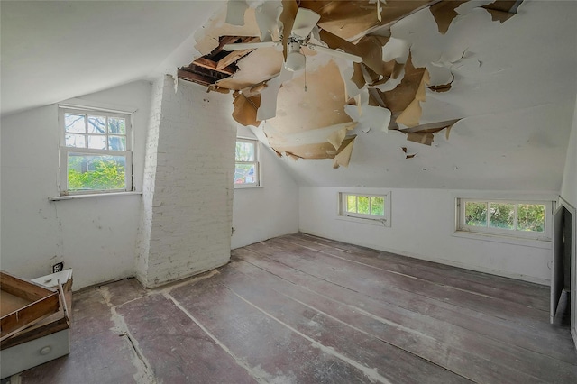 bonus room with plenty of natural light and lofted ceiling