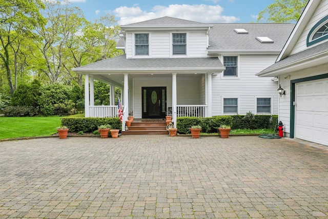 98 Beach Rd, Westhampton Beach, NY 11978 - view of front of home featuring a porch, a shingled roof, decorative driveway, and a garage