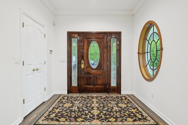 98 Beach Rd, Westhampton Beach, NY 11978 - entryway featuring dark wood finished floors, ornamental molding, and baseboards