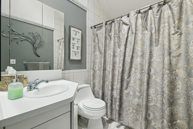 98 Beach Rd, Westhampton Beach, NY 11978 - full bath with tile walls, toilet, vanity, and a shower with shower curtain