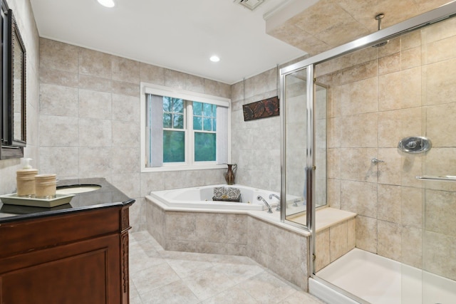 98 Beach Rd, Westhampton Beach, NY 11978 - bathroom featuring a stall shower, a garden tub, tile walls, tile patterned floors, and vanity