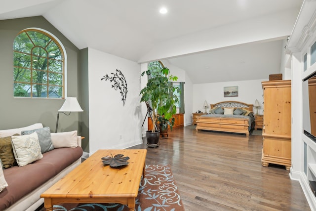 98 Beach Rd, Westhampton Beach, NY 11978 - living area with lofted ceiling, wood finished floors, recessed lighting, and baseboards