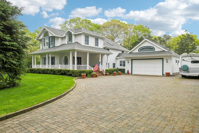 98 Beach Rd, Westhampton Beach, NY 11978 - view of front of house with covered porch, a garage, a front lawn, driveway, and roof with shingles