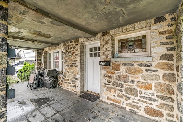 16 Rollhaus Pl, Port Chester, NY 10573 - view of exterior entry with covered porch and stone siding
