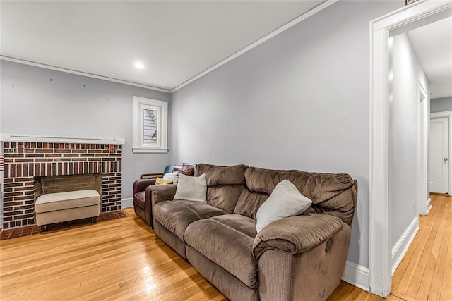 16 Rollhaus Pl, Port Chester, NY 10573 - living room with wood-type flooring, crown molding, a brick fireplace, baseboards, and recessed lighting