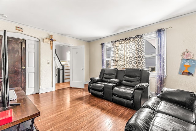 16 Rollhaus Pl, Port Chester, NY 10573 - living room with hardwood / wood-style flooring, stairway, a textured wall, and baseboards