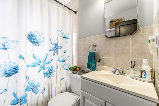 16 Rollhaus Pl, Port Chester, NY 10573 - full bathroom featuring vanity, tile walls, toilet, and curtained shower