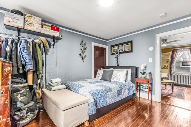16 Rollhaus Pl, Port Chester, NY 10573 - bedroom featuring radiator, wood-type flooring, and crown molding