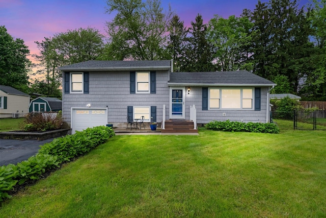 22 Willow Pl, Middletown, NY 10940 - tri-level home with a garage, asphalt driveway, and a shingled roof