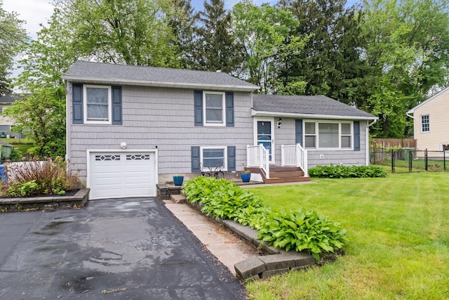 22 Willow Pl, Middletown, NY 10940 - tri-level home featuring a garage, roof with shingles, and asphalt driveway