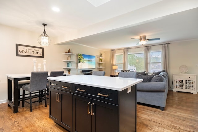 22 Willow Pl, Middletown, NY 10940 - kitchen featuring light countertops, light wood-style flooring, decorative light fixtures, a ceiling fan, and a center island