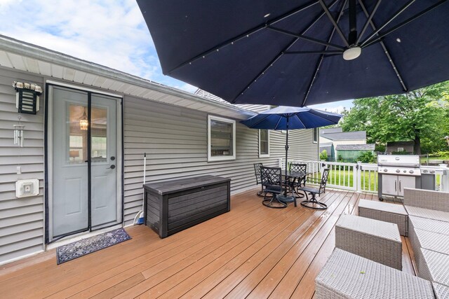 22 Willow Pl, Middletown, NY 10940 - wooden deck with outdoor dining space and a grill