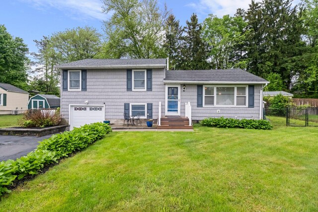 22 Willow Pl, Middletown, NY 10940 - tri-level home featuring an attached garage, driveway, and a shingled roof