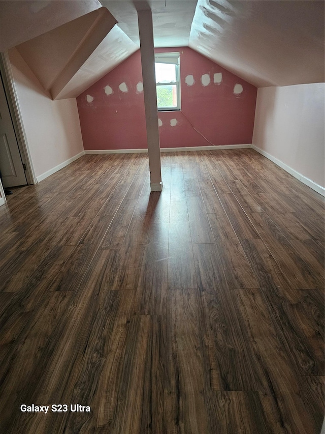 215 S 1st Ave, Mount Vernon, NY 10550 - additional living space with dark wood-style flooring, lofted ceiling, and baseboards