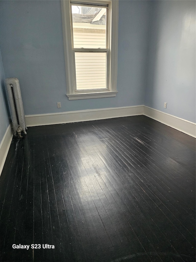 215 S 1st Ave, Mount Vernon, NY 10550 - unfurnished room featuring radiator, baseboards, and dark wood-style floors