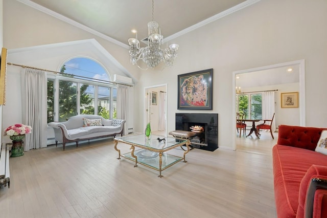 2525 Beverly Rd, Merrick, NY 11566 - living room featuring a chandelier, wood finished floors, a warm lit fireplace, crown molding, and baseboard heating