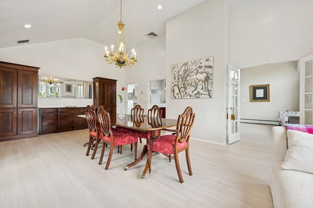 2525 Beverly Rd, Merrick, NY 11566 - dining space with a chandelier, a baseboard heating unit, light wood-style flooring, high vaulted ceiling, and baseboards