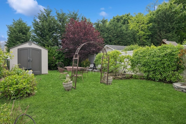2525 Beverly Rd, Merrick, NY 11566 - view of grassy yard featuring a storage shed and an outdoor structure