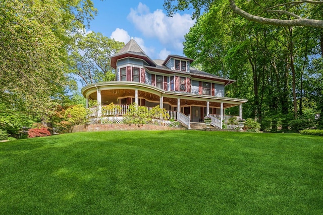 110 Red Spring Ln, Glen Cove, NY 11542 - rear view of house with covered porch and a yard