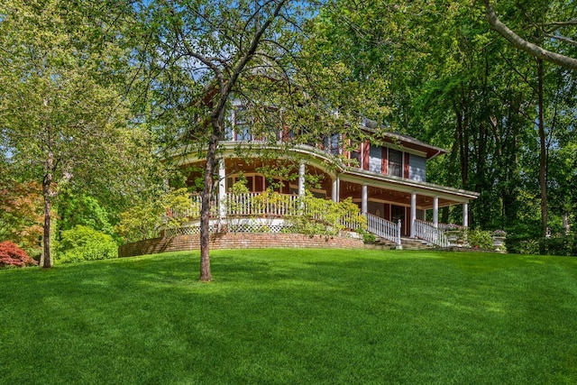 110 Red Spring Ln, Glen Cove, NY 11542 - back of property with a porch and a lawn