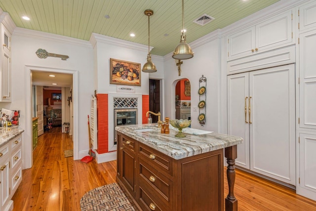 110 Red Spring Ln, Glen Cove, NY 11542 - kitchen with crown molding, white cabinetry, light wood-style floors, wooden ceiling, and recessed lighting