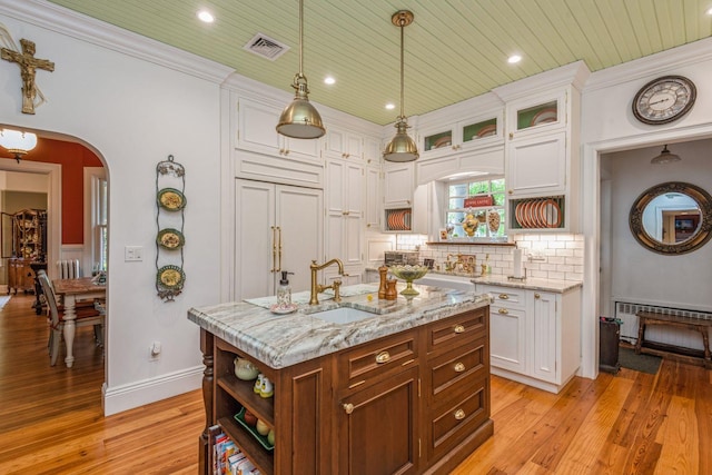 110 Red Spring Ln, Glen Cove, NY 11542 - kitchen featuring a sink, open shelves, white cabinets, light wood-style floors, and recessed lighting