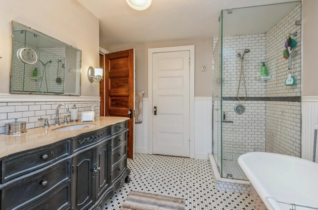 110 Red Spring Ln, Glen Cove, NY 11542 - full bath featuring a shower stall, vanity, wainscoting, and a freestanding tub