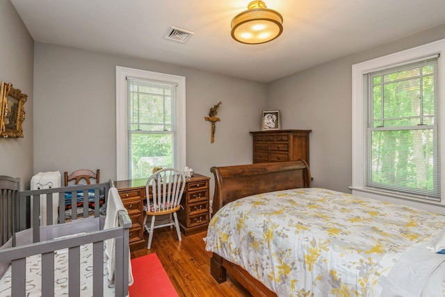 110 Red Spring Ln, Glen Cove, NY 11542 - bedroom featuring multiple windows and wood finished floors
